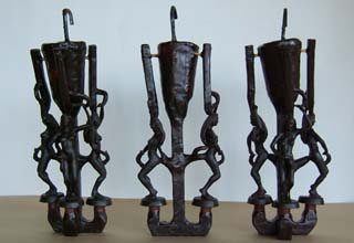 Eight originals mounted on wax sprue bars, pouring cups and vents will allow the molten bronze to flow into the final mold. Wax orignals of female figures dancing are attached in groups of 3, 2 and 3 to a central sprue bar with a pour cup on top. The metal will flow into the original from the bottom and vented out the top of the figures. Several additional paths are provided for the metal to ensure that even the smallest portions are filled properly.